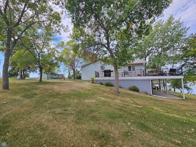 view of yard with a wooden deck