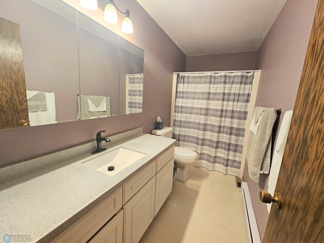 bathroom with vanity, a baseboard radiator, and toilet