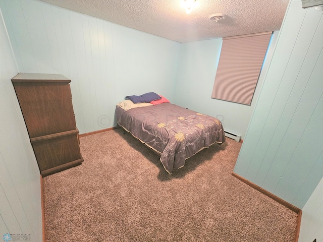 carpeted bedroom with a textured ceiling and baseboard heating