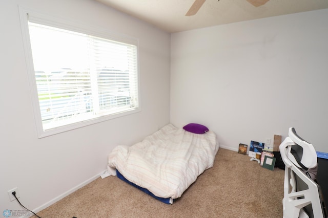 carpeted bedroom featuring ceiling fan