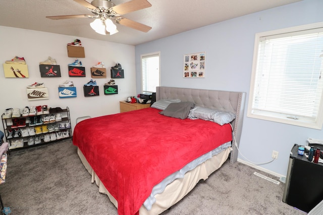 carpeted bedroom featuring ceiling fan