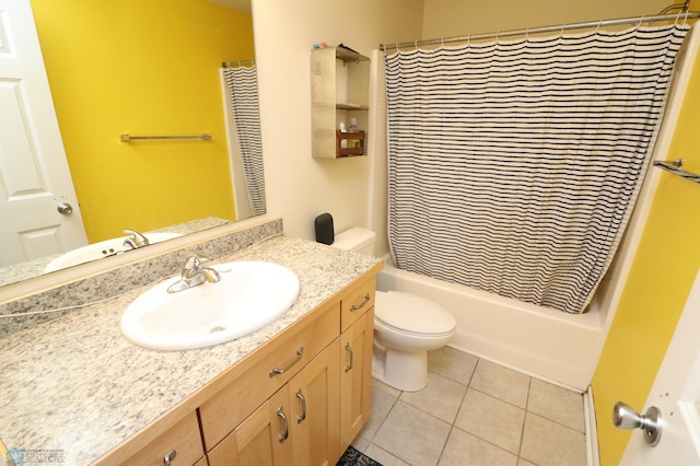 full bathroom with vanity, toilet, tile floors, and shower / bath combo