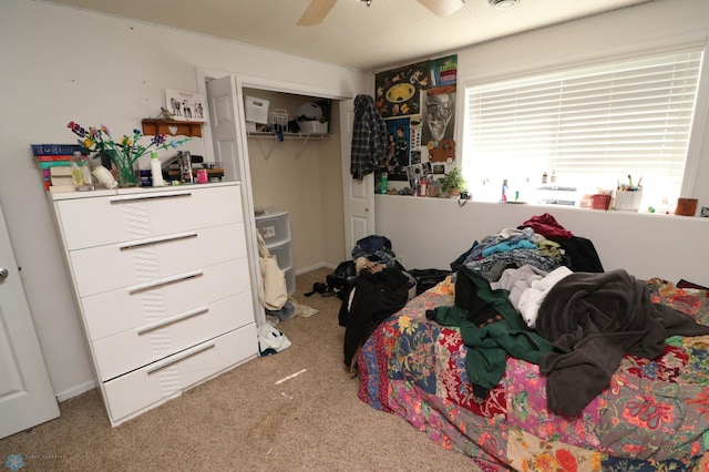 bedroom featuring a closet, carpet floors, and ceiling fan