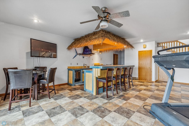 interior space featuring ceiling fan and light tile floors