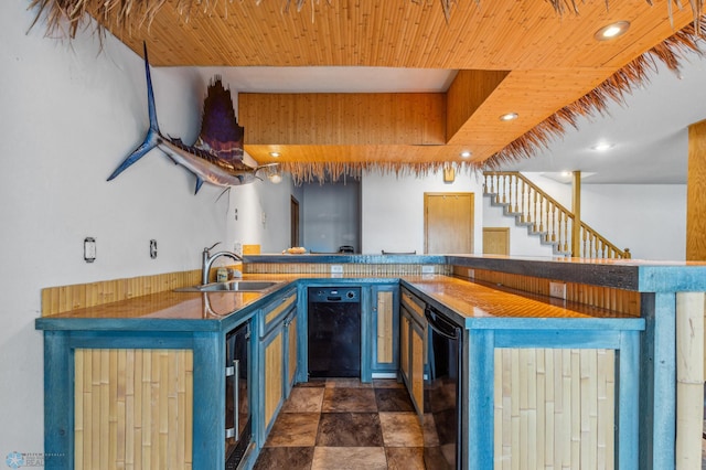 kitchen with beverage cooler, sink, dark tile flooring, black dishwasher, and blue cabinets