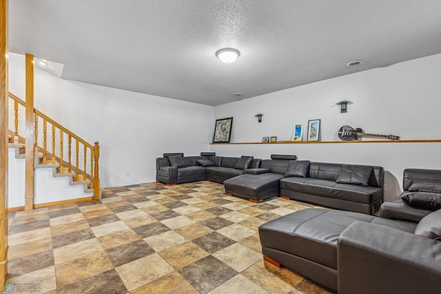 tiled living room with a textured ceiling