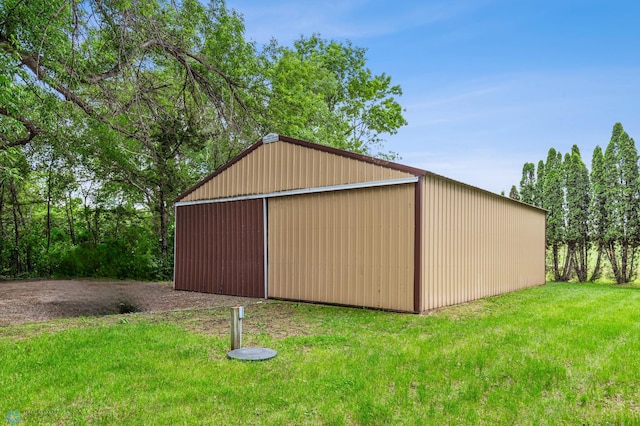 view of outdoor structure with a lawn