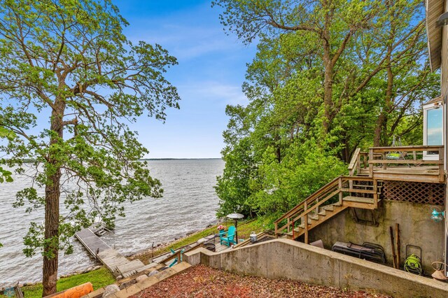 dock area with a water view