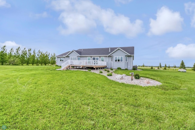 view of front of home with a front lawn and a wooden deck