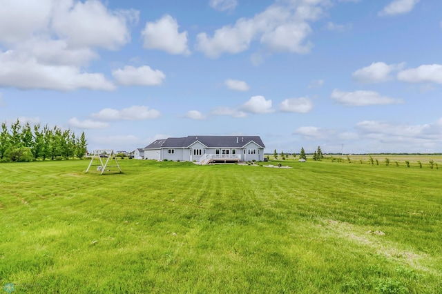 view of yard with a rural view