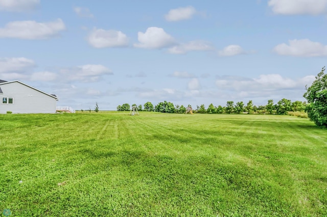 view of yard with a rural view