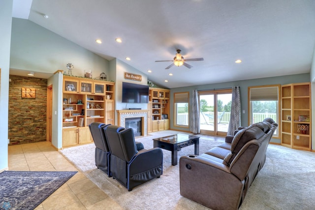 living room with ceiling fan, light tile flooring, and lofted ceiling