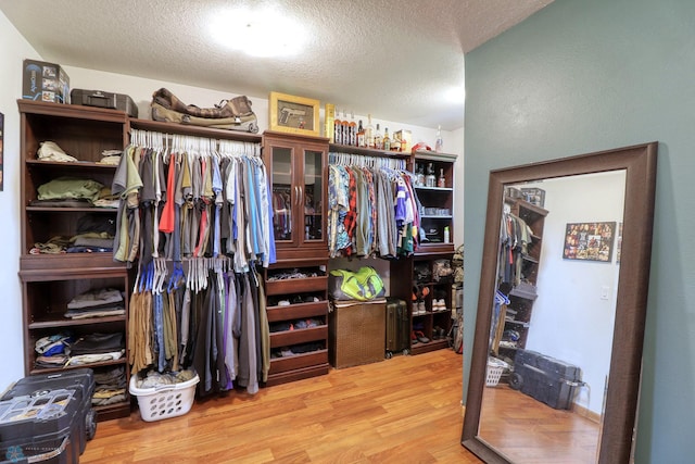 walk in closet featuring light hardwood / wood-style floors