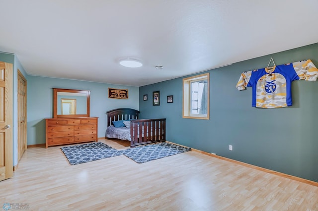 bedroom with hardwood / wood-style flooring