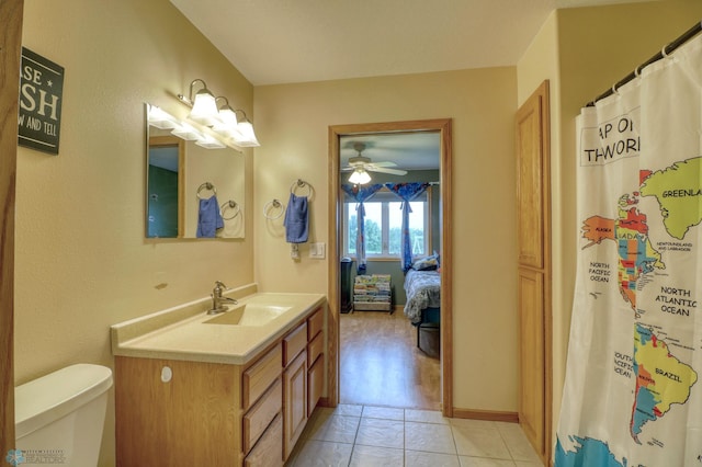 bathroom featuring ceiling fan, hardwood / wood-style floors, oversized vanity, and toilet