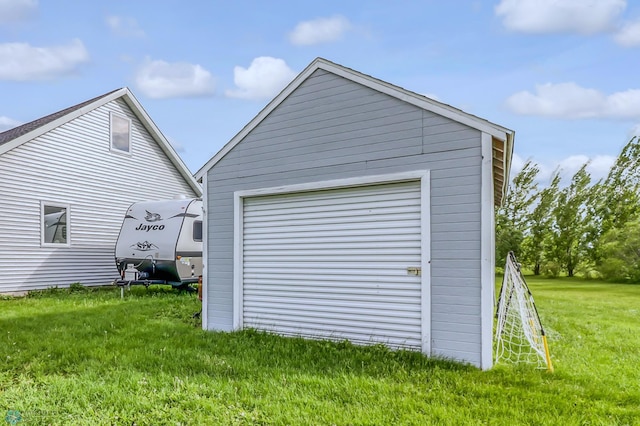 garage featuring a lawn