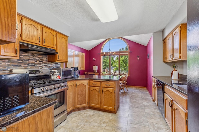 kitchen featuring a textured ceiling, lofted ceiling, stainless steel gas stove, backsplash, and light tile floors