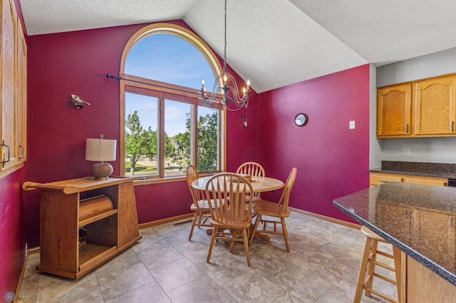 tiled dining space featuring a notable chandelier, vaulted ceiling, and a textured ceiling