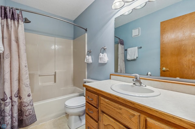 full bathroom featuring tile flooring, a textured ceiling, shower / bath combo with shower curtain, vanity with extensive cabinet space, and toilet