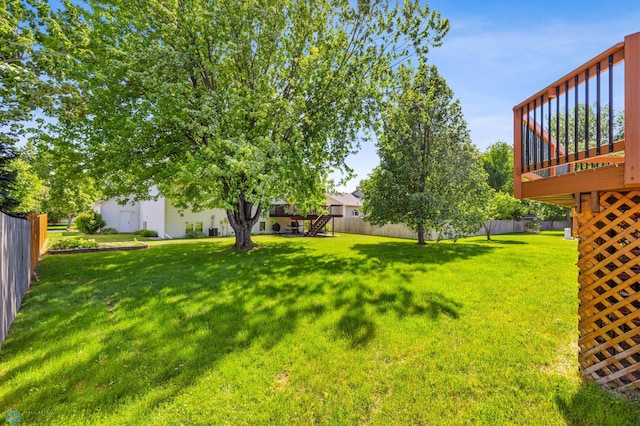 view of yard featuring a wooden deck