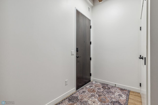 foyer with light wood-type flooring