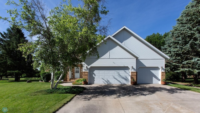 view of front of property with a garage and a front yard