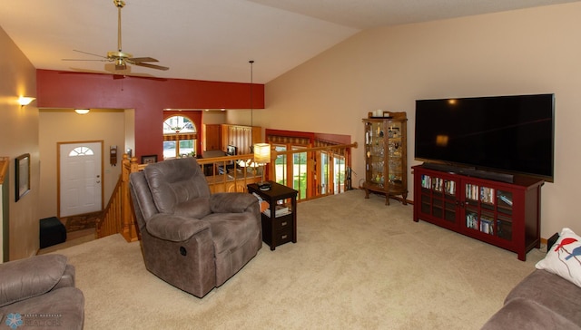 living room featuring ceiling fan, lofted ceiling, and light colored carpet