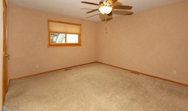 carpeted empty room with ceiling fan