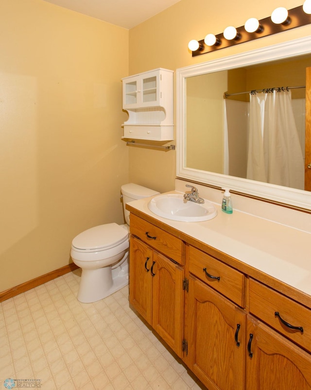 bathroom with toilet, walk in shower, tile patterned floors, and vanity