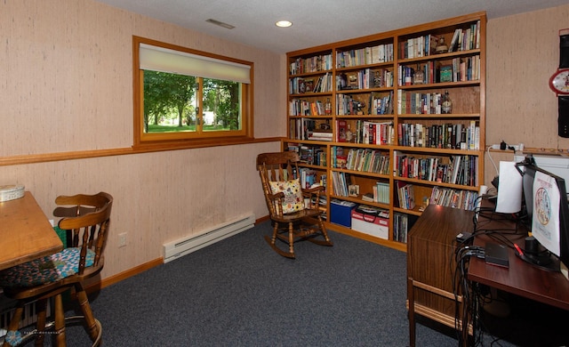 home office with a baseboard heating unit, a textured ceiling, and carpet flooring