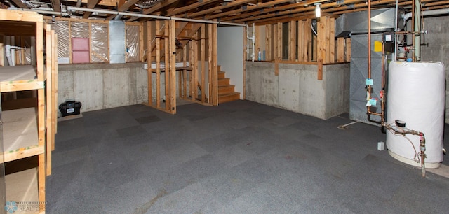 basement featuring carpet floors and water heater