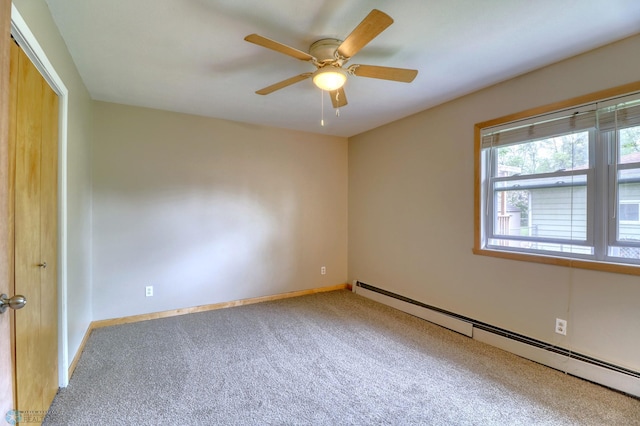 empty room with carpet flooring, a baseboard radiator, and ceiling fan