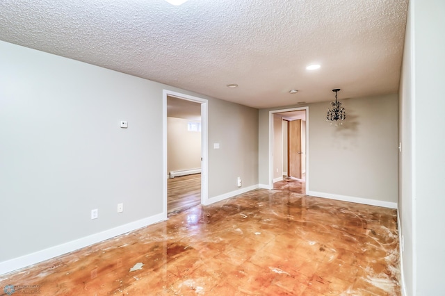 unfurnished room featuring a notable chandelier, a textured ceiling, and baseboard heating