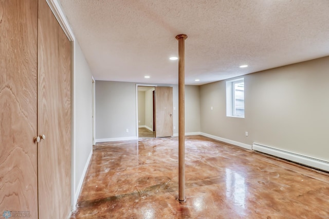 basement with a textured ceiling and a baseboard radiator