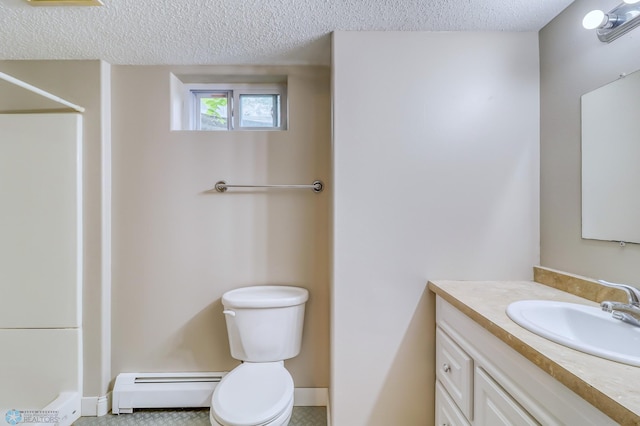 bathroom featuring tile floors, a textured ceiling, a baseboard heating unit, toilet, and vanity