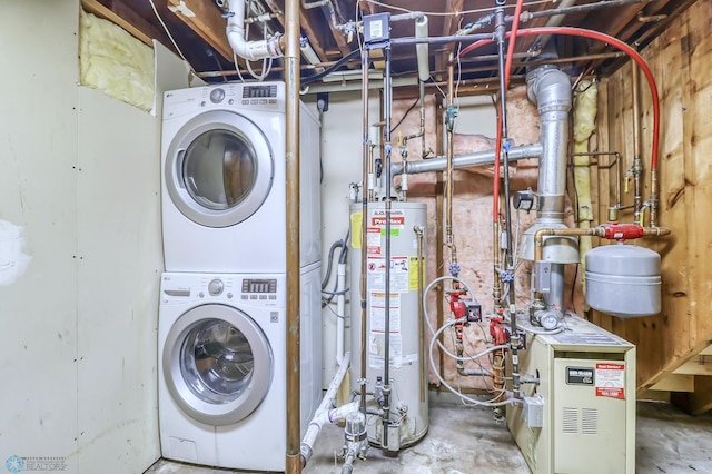 washroom with stacked washer and clothes dryer and water heater