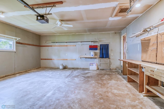 garage featuring a workshop area, ceiling fan, and a garage door opener