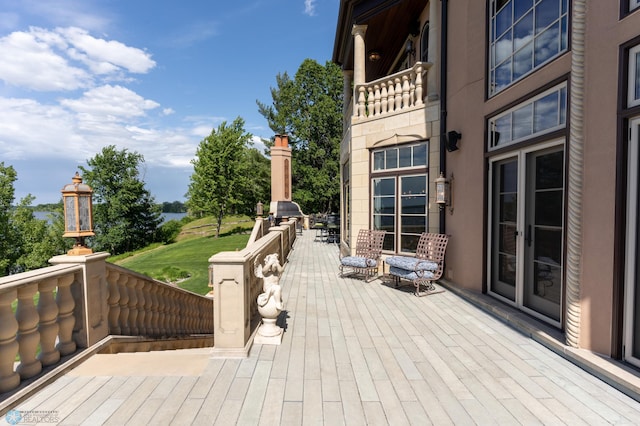 wooden terrace featuring area for grilling