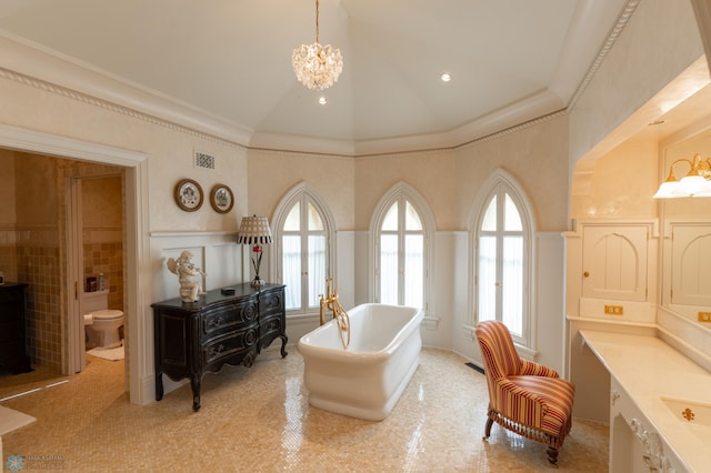 living area featuring high vaulted ceiling, a healthy amount of sunlight, and a chandelier