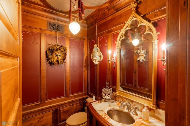 bathroom with large vanity and toilet