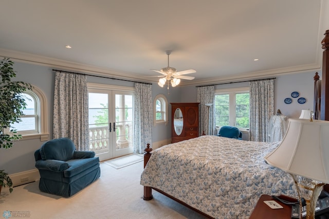 carpeted bedroom with ceiling fan, access to exterior, french doors, and ornamental molding