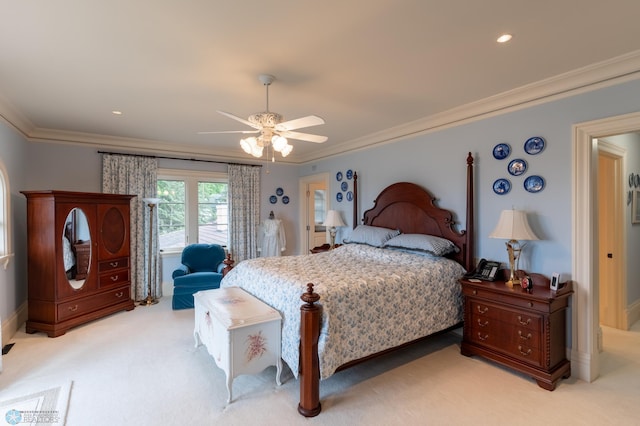 carpeted bedroom with ceiling fan and crown molding