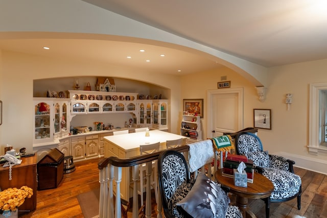 dining space with hardwood / wood-style floors