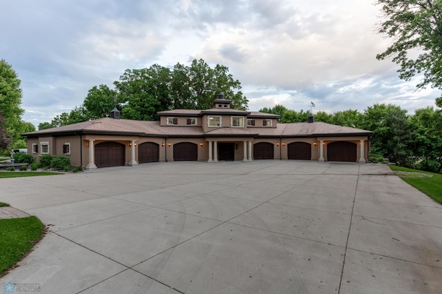 prairie-style home featuring a garage