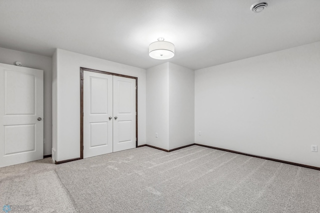 unfurnished bedroom featuring a closet and carpet