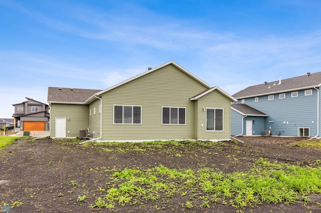 back of property featuring a garage