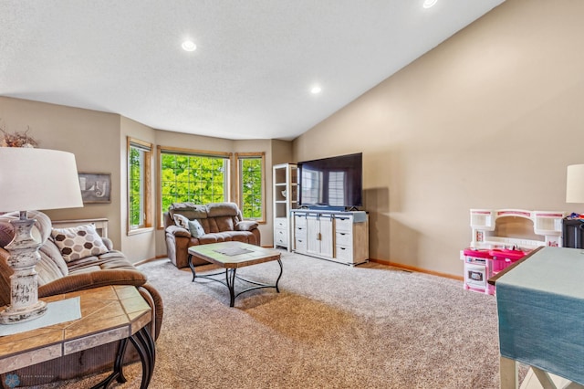 carpeted living room with high vaulted ceiling and a textured ceiling