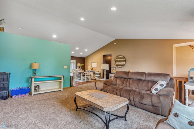 carpeted living room with vaulted ceiling