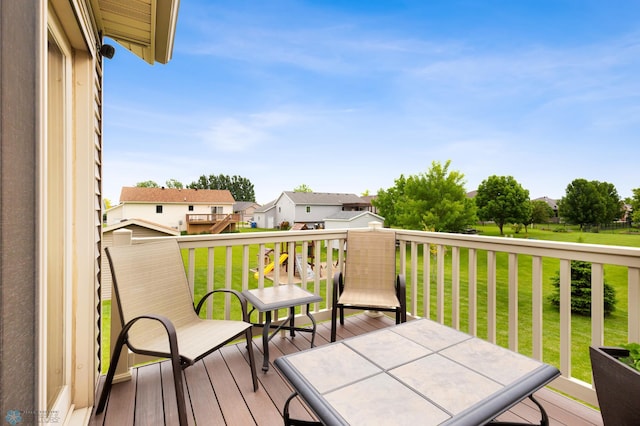 deck featuring a lawn