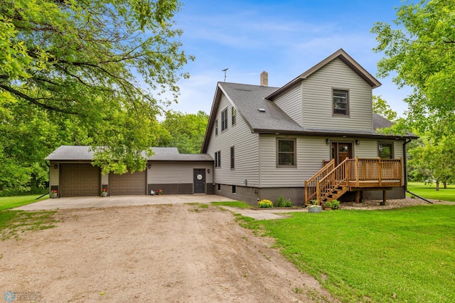 view of front of property with a garage and a front yard